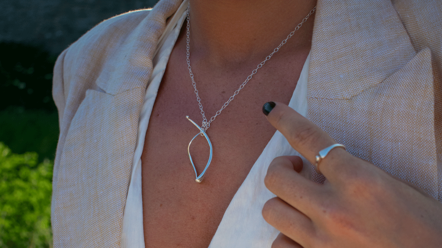 model wearing a lucia pendant in sterling silver by Susan Ohrn Jewelry